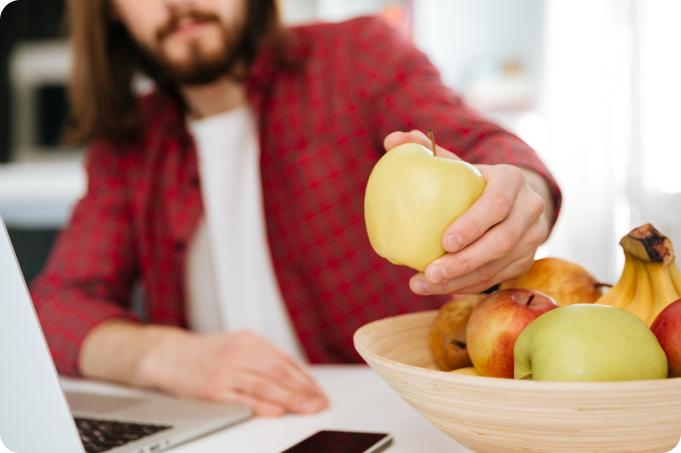 Closeup Man Eating Fruits Using Laptop Home 1